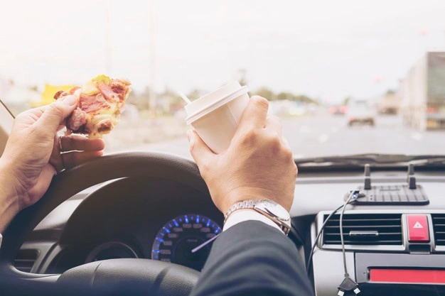 Driver eating at the wheel